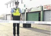  ?? PHOTO: DAMIEN EAGERS/INM ?? Shocking: A garda at the scene of the shooting at Mizzoni’s Pizzas in Edenmore.