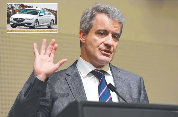  ?? Picture: AAP IMAGE ?? AXED: GM’s Julian Blissett announces in Melbourne yesterday that Holden brand will be retired in Australia, inset, a Holden Commodore.
