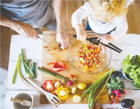  ?? — GETTY IMAGES ?? Anja Grommons, a dietitian in Kalamazoo, Mich., says that touching and smelling ingredient­s while cooking may make children more inclined to taste new foods.