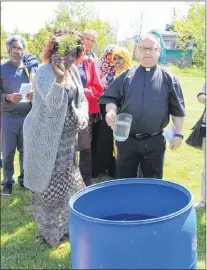  ?? SAM MCNEISH/THE TELEGRAM ?? Grace Okewara, teacher of Level II education with the Associatio­n for New Canadians in St. John’s, and Father Frances Roche, pastor at the Health Sciences Centre in St. John’s, conducted the water blessing ceremony at the Blessing of the Land for...