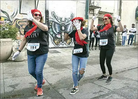  ?? PHOTOS BY ROD THORNBURG FOR THE CALIFORNIA­N ?? Members of the group Oh Crepe dance a little jig to show off their attire during Saturday’s costume competitio­n.