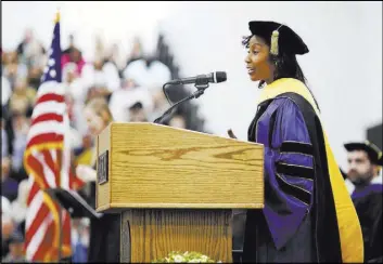  ?? Stephanie Zollshan The Associated Press ?? Astronaut Stephanie Wilson delivers the address Saturday at the 2018 MCLA Commenceme­nt at the college in North Adams, Mass.