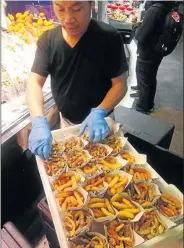  ?? Picture: Keith Tamkei ?? WELL SEASONED A fresh seafood-andchips stall at La Boqueria.