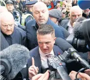  ??  ?? Newly appointed UKIP adviser and far-right activist Stephen Yaxley-Lennon, who goes by the name Tommy Robinson, leaves the Old Bailey after his contempt of court charge was referred to the Attorney General, in London, Britain last month.