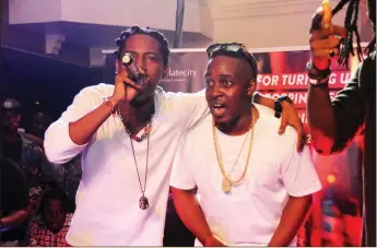  ??  ?? Jesse Jagz and Mi perform together