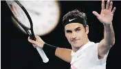  ?? VINCENT THIAN / THE ASSOCIATED PRESS ?? Roger Federer celebrates after defeating Tomas Berdych at the Australian Open on Wednesday.