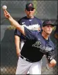  ?? CURTIS COMPTON CCOMPTON@AJC.COM ?? Kyle Wright delivers a pitch working from the mound during spring training in North Port, Fla.