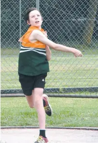  ??  ?? Under 13 athlete Campbell Young hurled his discus 18.42 metres.