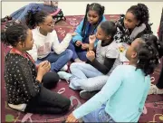  ?? Kristina Wilder / Rome City Schools ?? North Heights students (clockwise from left) Destani White, Raziah Carey, Legacy Adams, Zakeria Heath, Janiqua Smith and Avielle Beedles share stories with each other after the storytelli­ng class.