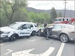  ?? LAGUNA BEACH POLICE DEPARTMENT ?? A Tesla sedan, reportedly with the Autopilot driver-assistance system turned on, crashed into a Laguna Beach Police Department SUV on Tuesday.