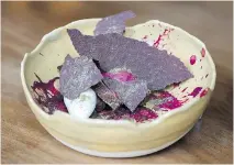  ??  ?? Tradition with a twist: the chocolate cake comes with concord grape sorbet, white chocolate cream and chocolate tuiles sprinkled with caraway.