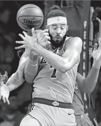  ?? ROBERT GAUTHIER LOS ANGELES TIMES ?? CENTER JaVale McGee juggles a rebound in the Lakers’ 112-107 victory over Oklahoma City.
