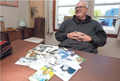  ?? TIMOTHY T. LUDWIG, USA TODAY SPORTS ?? Bruce Beyer sits in front of photos that include ones of Joe Tipton, his biological father who played seven major league seasons.