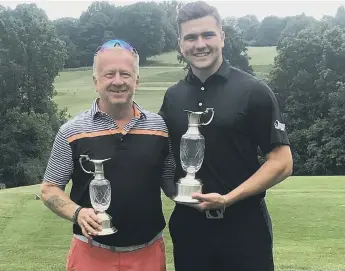  ??  ?? Nigel King (left) and Gregor MacIntosh with their trophies