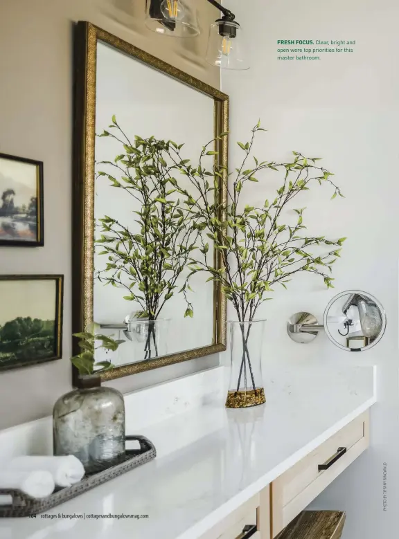  ??  ?? FRESH FOCUS. Clear, bright and open were top priorities for this master bathroom.