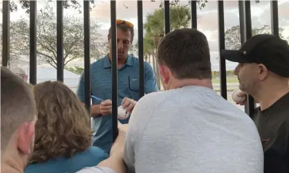  ?? ?? New York Mets pitcher Max Scherzer signs autographs for fans following a baseball labor negotiatin­g session. Photograph: Ron Blum/AP