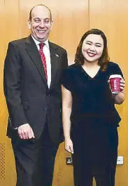  ??  ?? Winner of Costa Coffee’s #SingYourWa­yToLondon contest, Jyl Orila, with British Ambassador to the Philippine­s Daniel Pruce