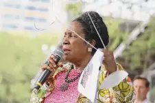  ?? ?? U.S. Rep. Sheila Jackson Lee holds a hanger as she addresses the crowd about Texas’ possible ban on all abortions.