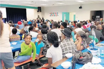  ?? SUBMITTED PHOTO ?? Broward County families learn how to turn meal time into family time through the Hot Food Hot Topics/Fresh Food Fresh Ideas summer series.