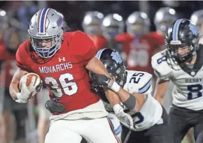  ?? LORRIE CECIL/THISWEEK ?? Gabe Powers (36) and Marysville defeated Hilliard Darby 21-14 in overtime on Friday.