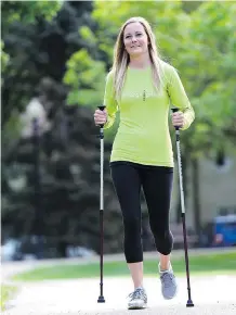  ?? TROY FLEECE/ REGINA LEADER- POST ?? Exercise therapist Cayt Foulston shows how poling can burn calories while reducing wear and tear on joints.