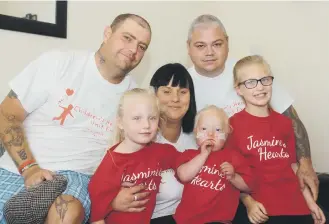  ??  ?? Jasmine Purvis with mum Jamie Harvey and sisters Jessie Robins and Jodie Robins and dad Christophe­r Purvis and granddad Colin Hope.