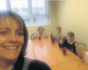  ??  ?? Reward Mrs Gayle Ferguson takes a selfie with youngsters enjoying their hot drinks