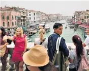  ?? ?? The Rialto Bridge in Venice is a popular destinatio­n for visitors