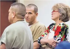  ??  ?? Daniel Martinez, accused of firing the shot that killed Edgewood gas station attendant Michael Pelkey in a $49 armed robbery, enters a Santa Fe courtroom for arraignmen­t on Thursday.