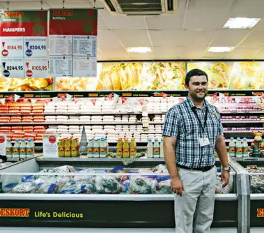  ??  ?? Pieter Strydom is the manager of Eskort Butchery, where the shelves and fridges are filled with an amazing array of products.