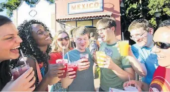  ?? JOE BURBANK/STAFF FILE PHOTO ?? Epcot guests enjoy drinks from Mexico pavilion in this 2013 photo from the Internatio­nal Food &Wine Festival.