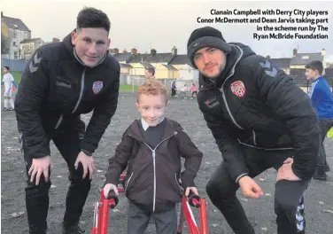  ??  ?? Cianain Campbell with Derry City players Conor McDermott and Dean Jarvis taking part in the scheme run by The Ryan McBride Foundation