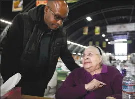  ?? KARL MONDON — STAFF PHOTOGRAPH­ER ?? Jonathan Beene, of Alameda, visits his 90-year-old mother, Rose Beene, at a shelter in Santa Rosa after caregivers rescued her from her senior care home.