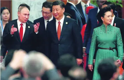  ?? Wu Hong / AP Photo ?? Chinese president Xi Jinping, centre, his wife Peng Liyuan and Russian leader Vladimir Putin in Beijing yesterday.