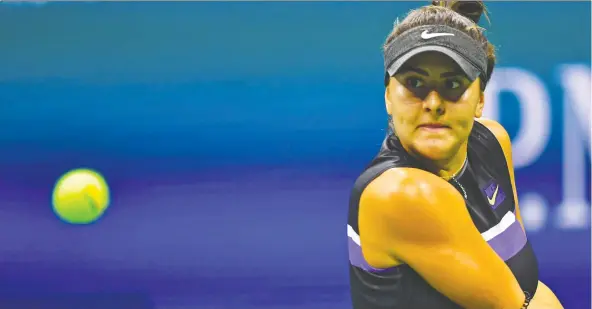  ?? JOHANNES EISELE/AFP/GETTY IMAGES ?? Canada’s Bianca Andreescu hits a return Thursday against Switzerlan­d’s Belinda Bencic during their U.S. Open semifinal at the USTA Billie Jean King National Tennis Center in New York. Andreescu will face American star Serena Williams in Saturday’s final after a 7-6 (3), 7-5 win.