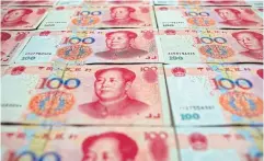  ?? REUTERS ?? Chinese 100 yuan banknotes.