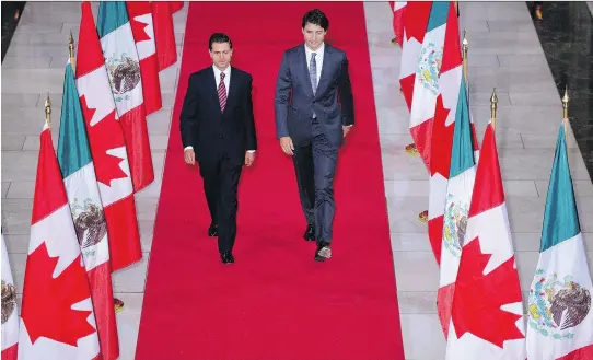  ?? SEAN KILPATRICK/THE CANADIAN PRESS FILES ?? Prime Minister Justin Trudeau and Mexican President Enrique Pena Nieto are facing potential trade conflict under the Trump administra­tion.