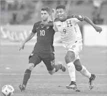  ?? Johan Ordonez AFP/Getty Images ?? CHRISTIAN PULISIC, left, has scored or helped to set up nine of the 12 U.S. goals in the World Cup qualifying tournament.