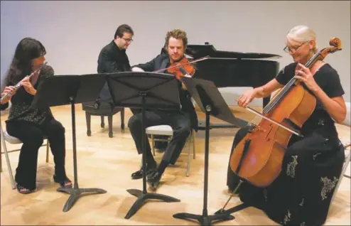  ?? COURTESY PHOTO ?? Nancy Laupheimer on flute in performanc­e with the Taos Chamber Music Group.