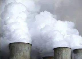  ??  ?? Steam rises from the cooling towers of the coal power plant of RWE, one of Europe’s biggest electricit­y and gas companies in Niederauss­em, north-west of Cologne, Germany. (Reuters)