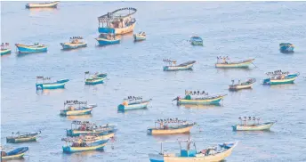  ??  ?? A picture shows a view of fishing boats at Gaza city’s port.