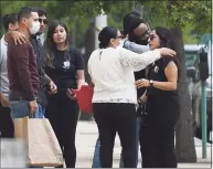  ?? Tyler Sizemore / Hearst Connecticu­t Media ?? Family of the late Valerie Reyes, including her mother, Norma Sanchez, center, embrace one another after the sentencing of Javier Da Silva at the Charles L. Brieant Jr. United States Courthouse in White Plains, N.Y., Thursday. Da Silva pleaded guilty to kidnapping resulting in death and was sentenced to 30 years in prison Thursday by Judge Vincent Briccetti. Reyes’ body was dumped in the woods of Greenwich after Da Silva placed her in a suitcase bound in packing tape and twine in January 2019, according to federal prosecutor­s.