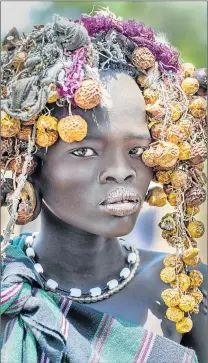  ??  ?? NATURAL BEAUTY: An unidentifi­ed young woman from the Mursi tribe