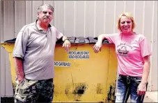  ?? RACHEL DICKERSON MCDONALD COUNTY PRESS ?? Noel Mayor John Lafley, left, and Southwest Sanitation owner Shannon Gravette are pictured with one of the McDonald County Recycle Center’s yellow recycling containers.