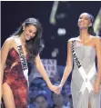  ?? EPA-EFE ?? MISS Philippine­s Catriona Gray and Miss South Africa Tamaryn Green wait for the announceme­nt of the winner during the Miss Universe 2018 beauty pageant in Bangkok, Thailand. The title was clinched by Gray. |