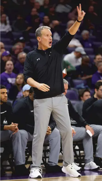  ?? GETTY IMAGES ?? Coach Chris Collins’ Wildcats, who play Minnesota on Saturday, are 14-5 overall and 5-3 in the Big Ten.