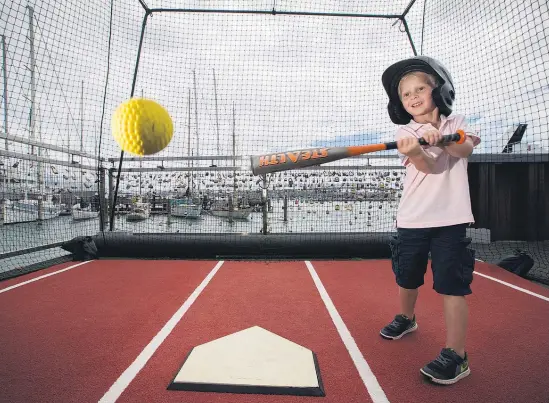  ?? Picture / Nick Reed ?? Ryder Beard takes a swing in the Wynyard Quarter.