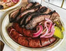  ??  ?? Brisket and sausage from Khoi Barbecue