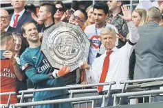  ??  ?? Arsenal’s French manager Arsene Wenger (right) and Arsenal’s Czech goalkeeper Petr Cech (left) hold up the trophy as they celebrate after their victory in the English FA Community Shield football match between Arsenal and Chelsea at Wembley Stadium in...