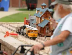  ?? Max Levy, Reporter-herald ?? The Good Samaritan Model Railroad can be seen at the Good Samaritan Society senior community’s Western town. Phil “Trip” Tripician, the railroad club’s vice president, is in the foreground.